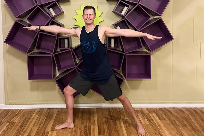 A young man doing yoga at Inspirit Yoga Studio